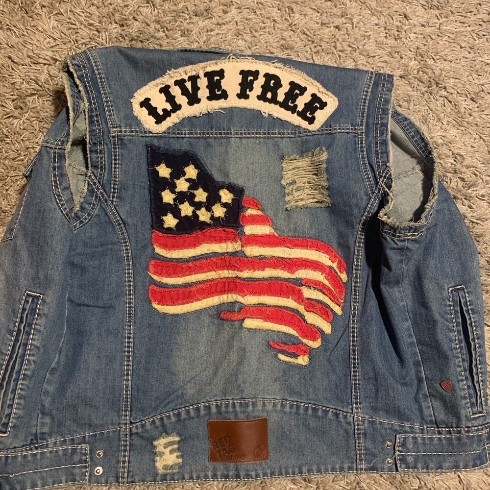 Denim jean jacket with the sleeves cut